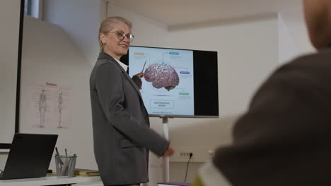 teacher giving a presentation on the brain