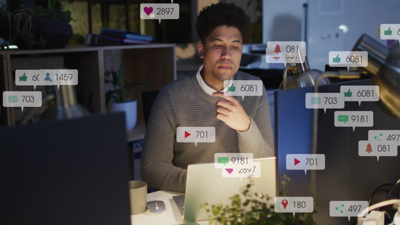 Animation of multiple notification bars over biracial man analyzing and preparing reports on laptop
