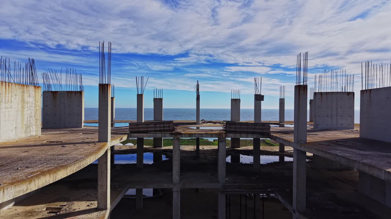 View from unfinished building revealing ocean and skyline