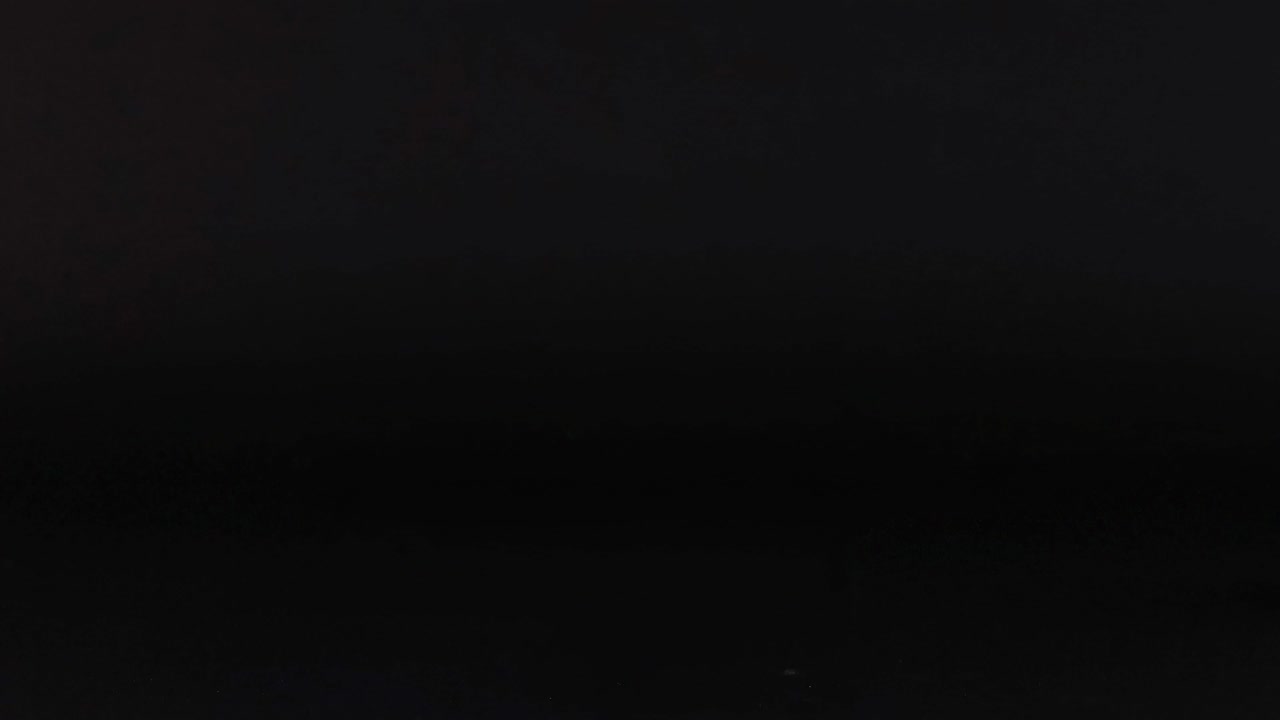 A series of tennis balls positioned on a black grid background, showcasing motion and placement.