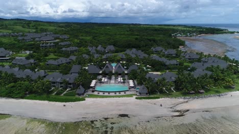 people walking on beach resort in fiji, tracking shot