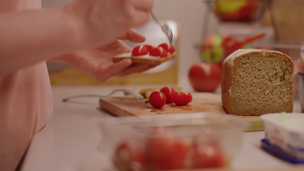 Making a Tomato and Cream Cheese Sandwich