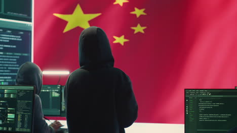 terrorist person in a chinese cyber security room hacking national systems