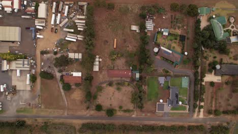 top down large blocks of land next to a freight company, rural australia