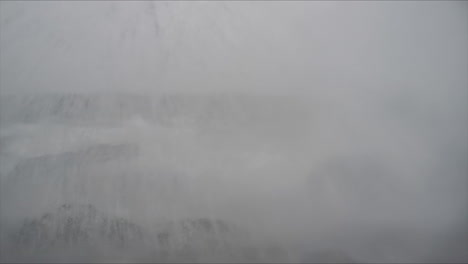 slow motion shot of a wave breaking on the shore of lake superior