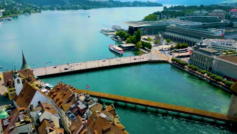 4k drone video of the chapel bridge crossing the reuss river near lake luzerne in lucerne, switzerland