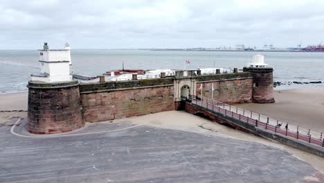 fort perch rock new brighton sandstone coastal defence battery museum peel port aerial low left orbit view