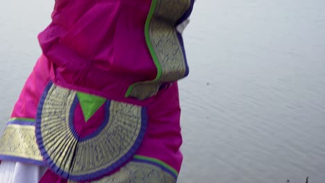 A-bharatnatyam-dancer-displaying-a-classical-bharatnatyam-pose-in-the-nature-of-Vadatalav-lake,-Pavagadh