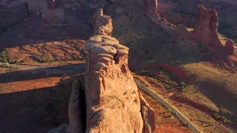 4k aerial of rock formations in a desert landscape - arches national park, utah, usa