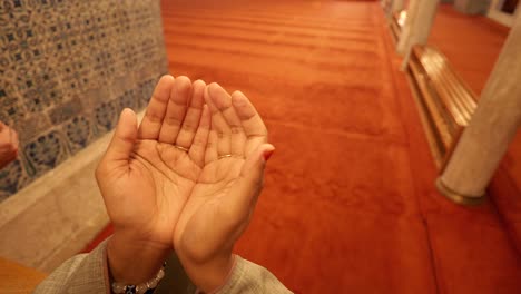 a person praying in a mosque