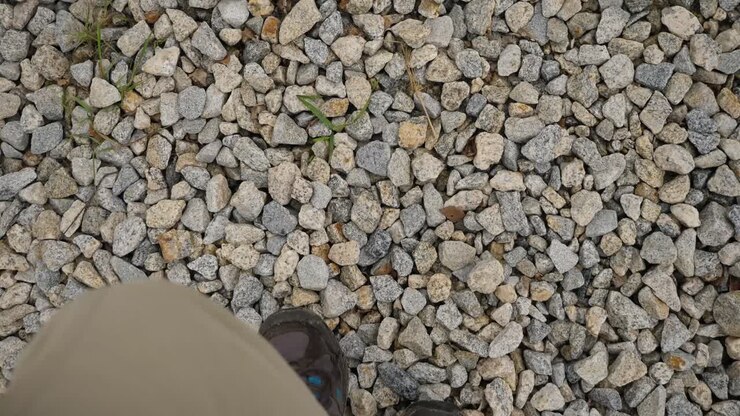 Person walking on gravel path