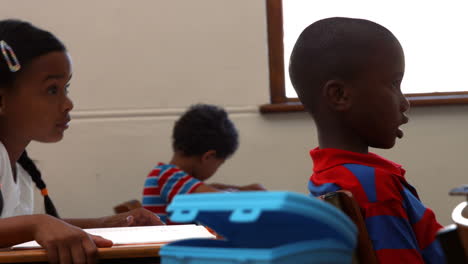 school children in class at school