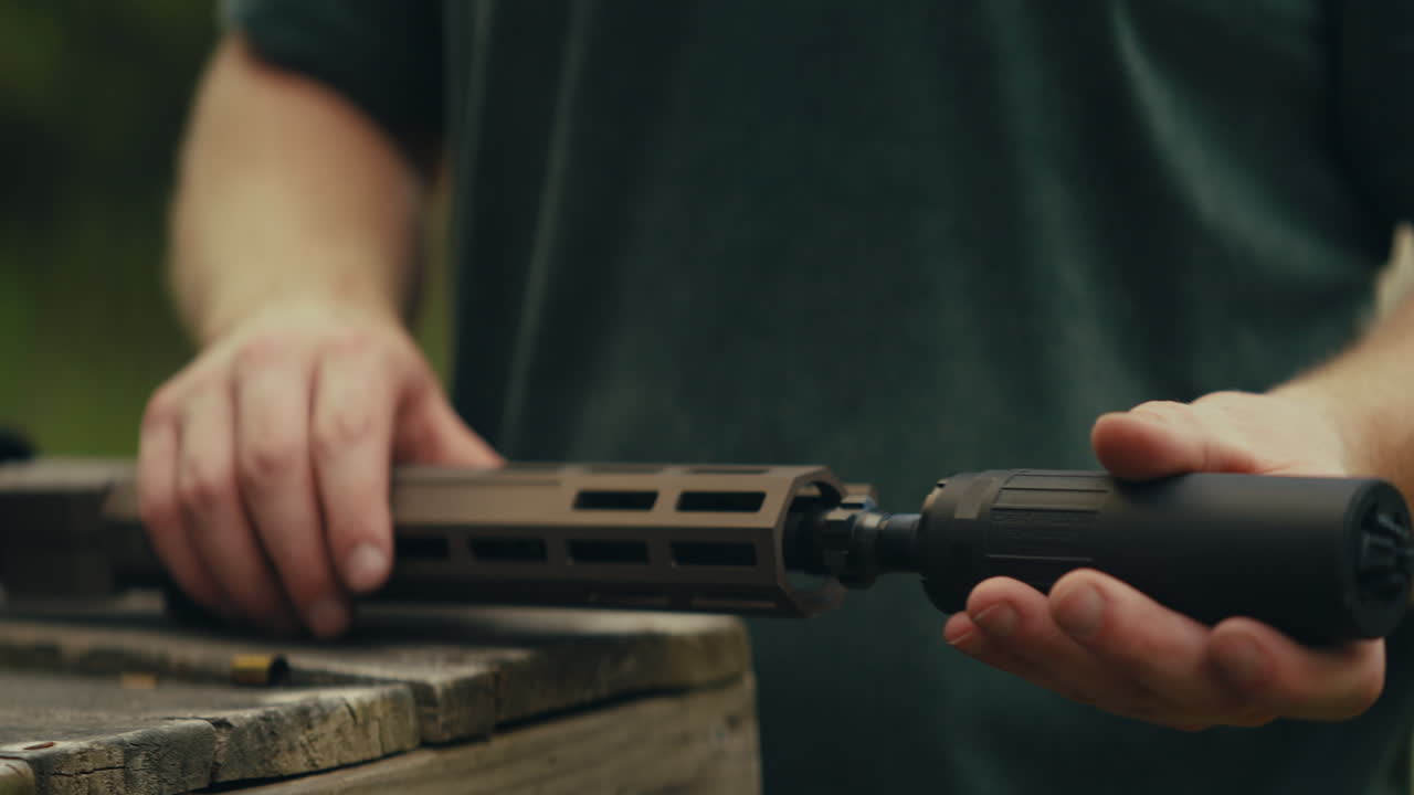 Attaching a suppressor to a rifle
