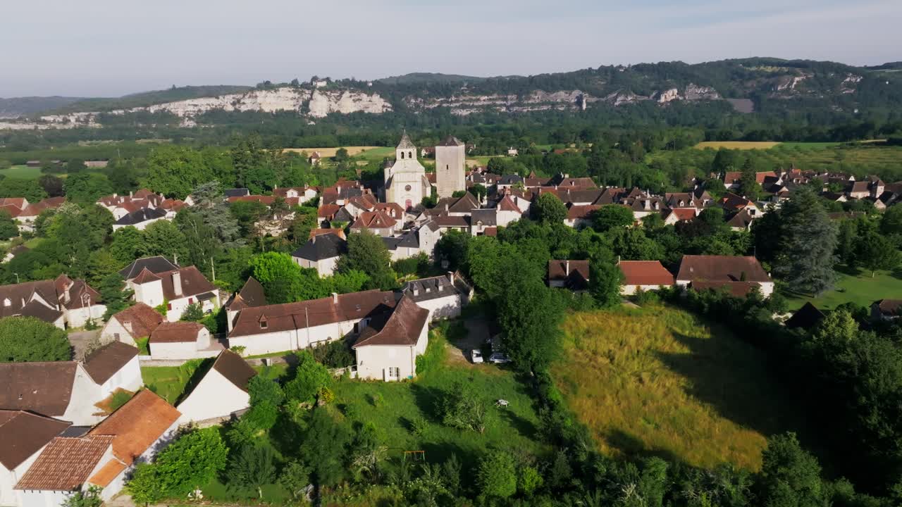Circular aerial view of the village of Floirac, with cliffs behind the church, Lot, France