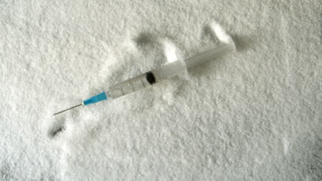 needle falling into pile of sugar