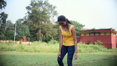 teenage young girl tired doing fitness training and runs towards camera, takes rest and runs again, slow motion