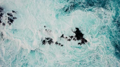 powerful waves crashing over rocky coastline