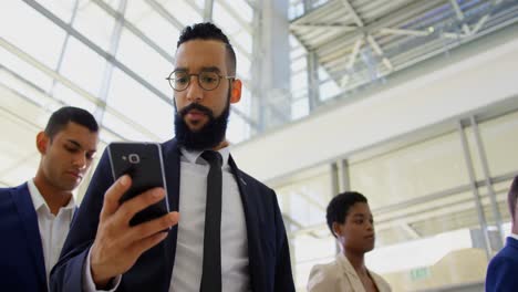 Mixed-race-businessman-standing-in-queue-at-business-seminar-4k