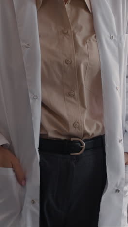 portrait of a confident female doctor in a white coat