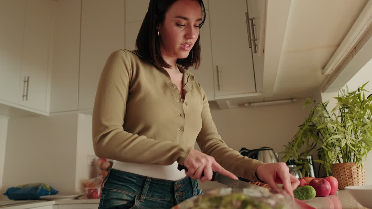 Woman Making Healthy Salad in Kitchen. Foodblog