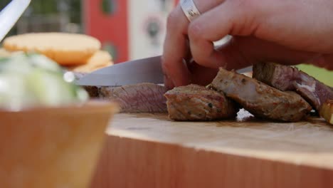 meat being sliced with a knife