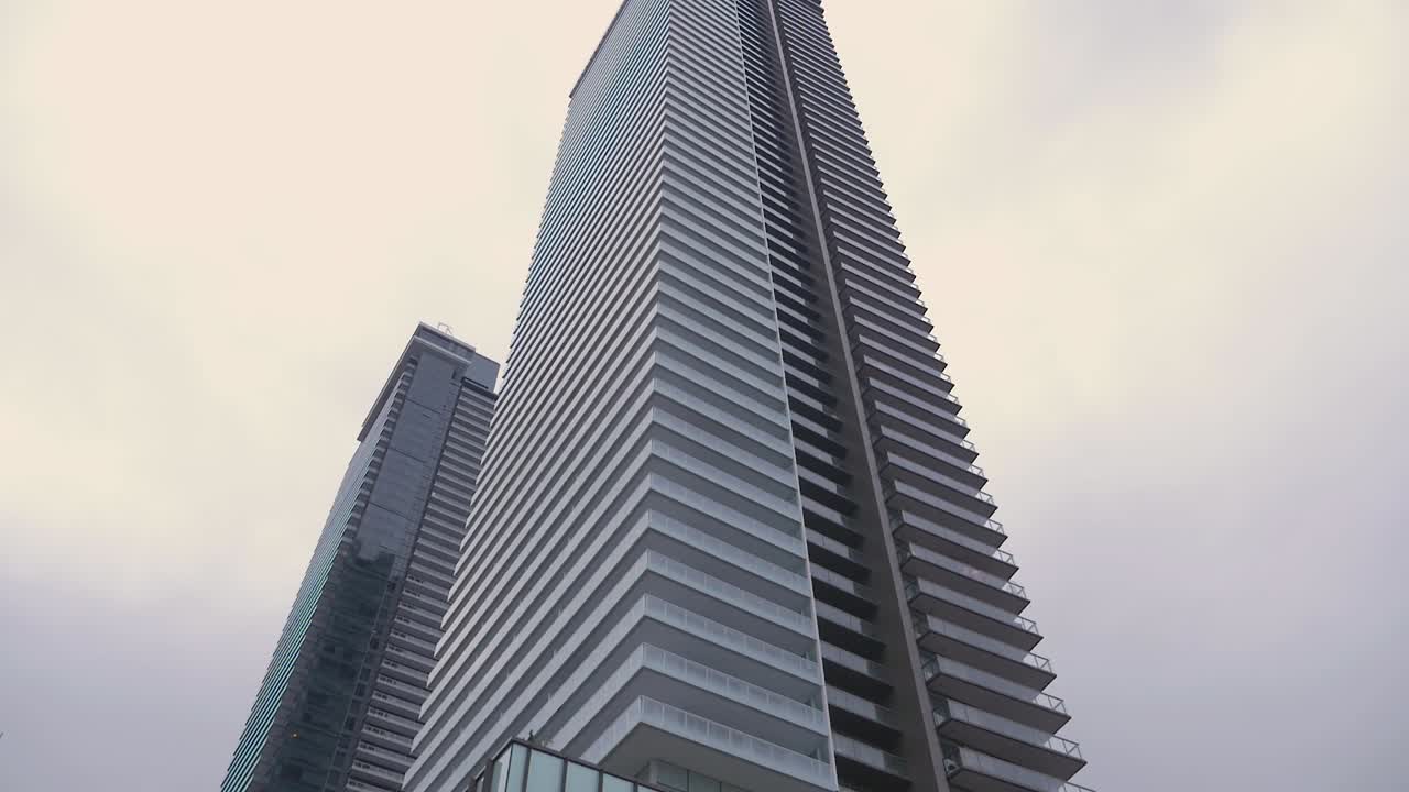 modern glass cement building in new urban city  development modern skyscraper residential living real estate brentwood burnaby BC canada