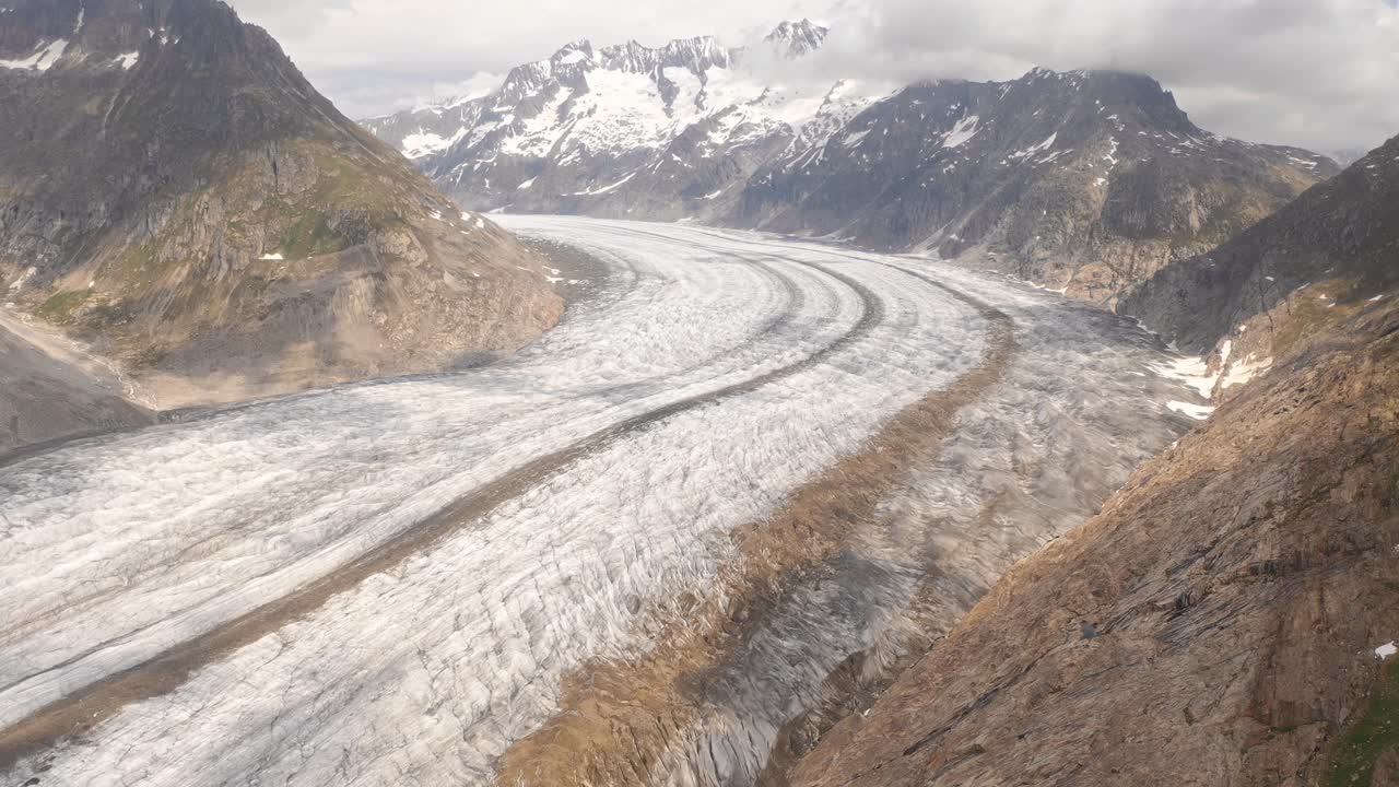 Winding glacier in Norway with mountainous landscape and snowy peaks