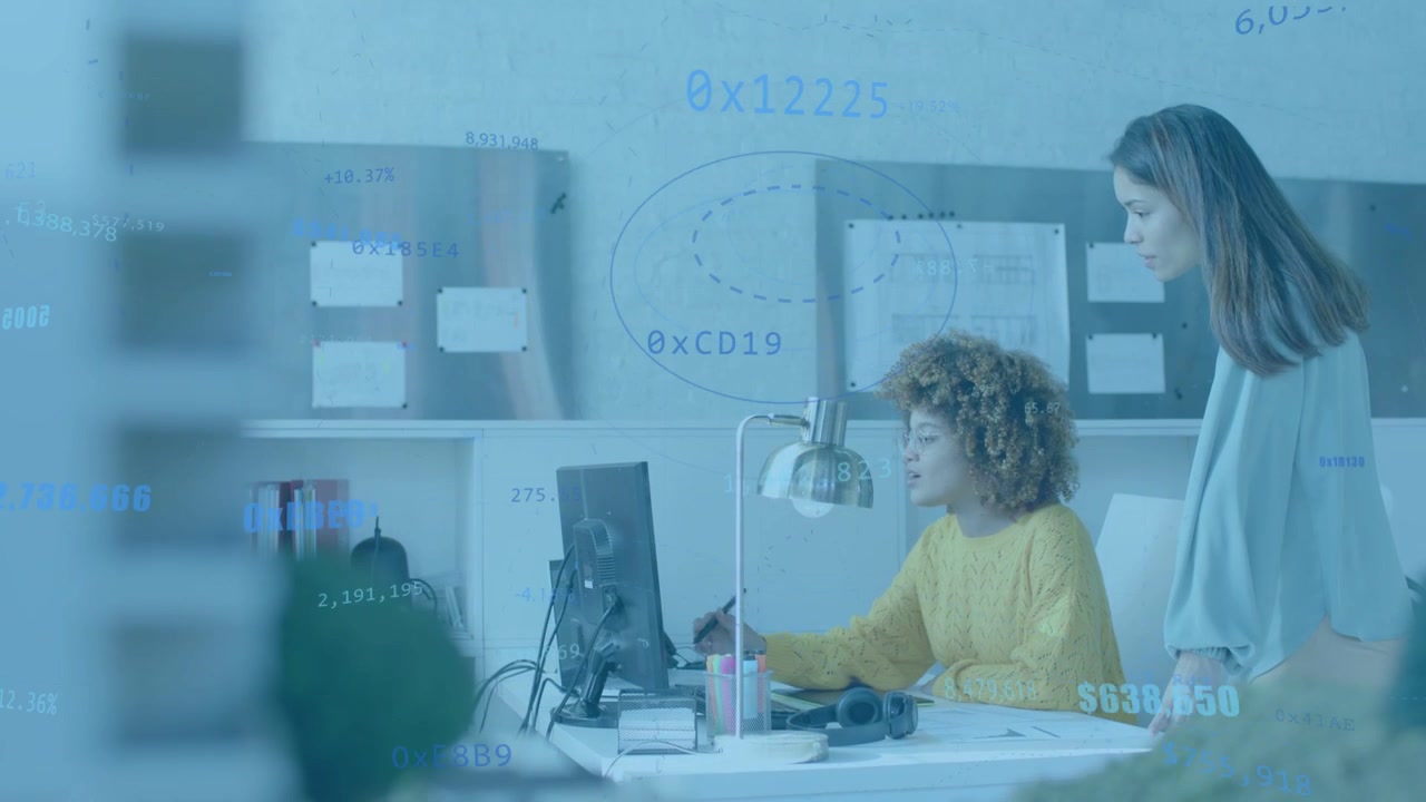 Curly analyst pointing stylus at monitor while peer entering and starting reviewing animated data