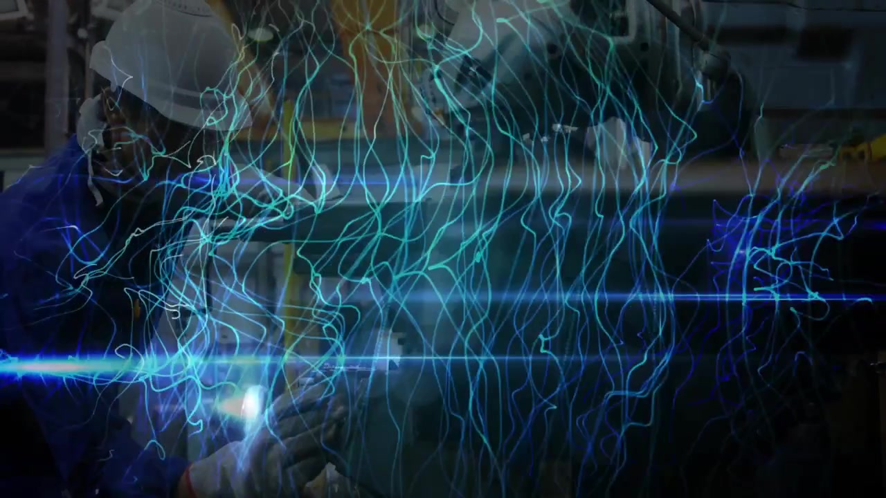 Factory worker adjusting tool and executing welding cut while animated overlay analyzing efficiency