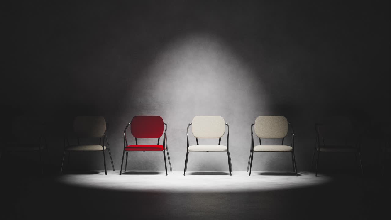 Red Chair Slides into Spotlight Among Empty Chairs