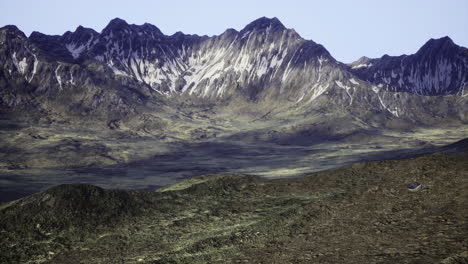 majestic mountain range with snow capped peaks during bright daylight