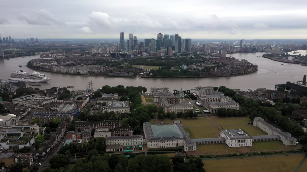 Aerial video footage of Greenwich Royal Arsenal and Canary Wharf, the City of London clearly showing the River Thames as it circles the Isle of Dogs