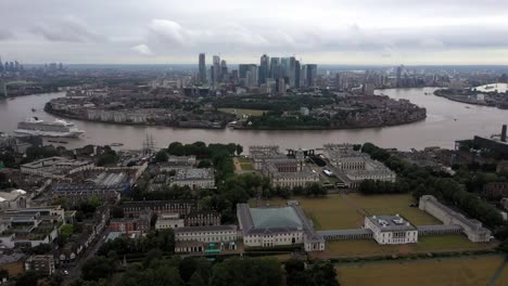 aerial video footage of greenwich royal arsenal and canary wharf, the city of london clearly showing the river thames as it circles the isle of dogs