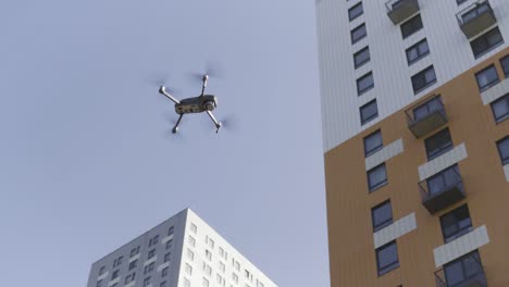 drone flying over apartment buildings