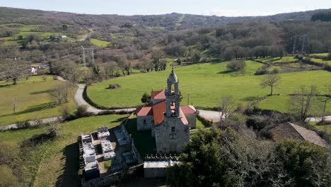 Aerial-Pullback-Above-Santa-Maria-De-Castrelo-Church-In-San-Xoan-De-Rio