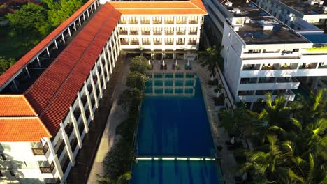 tropical resort hotel with pools in indonesia, aerial view