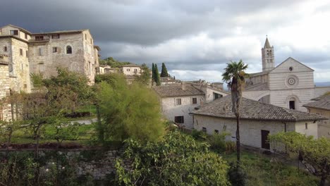 view out the window of the medieval town of assisi, italy landscape and churches