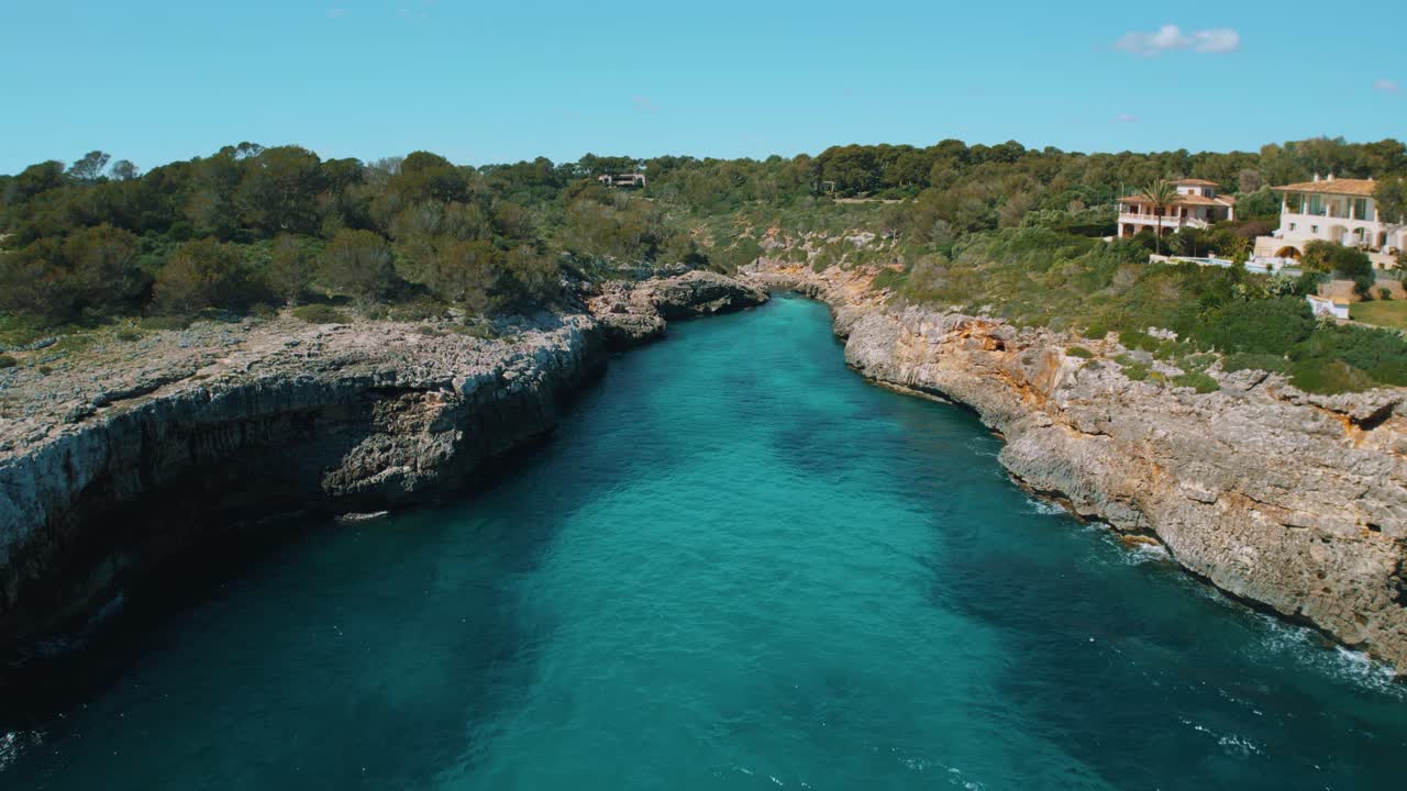 Remote natural bay with clear turquoise blue sea water and white sand beach, Palma de Mallorca Island