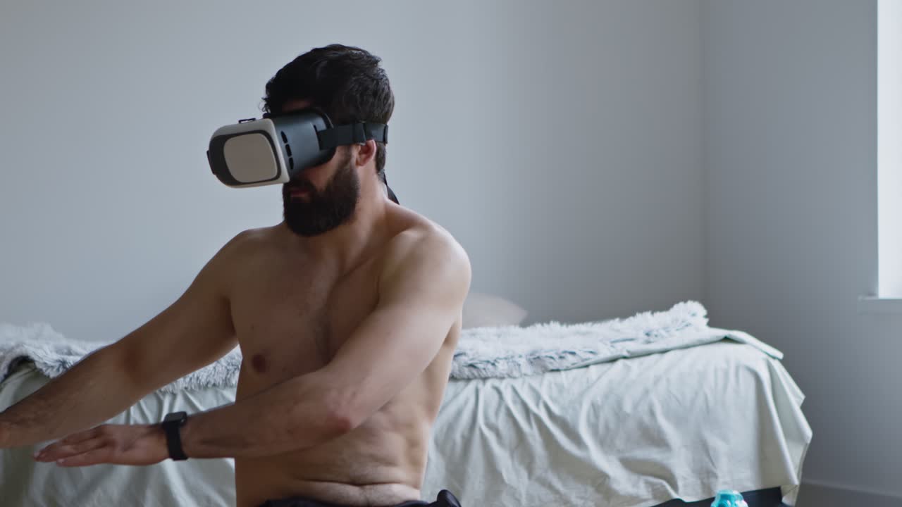 침실에서 vr 헤드을 착용한 남자