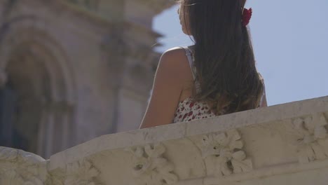 girl looking at architectural detail