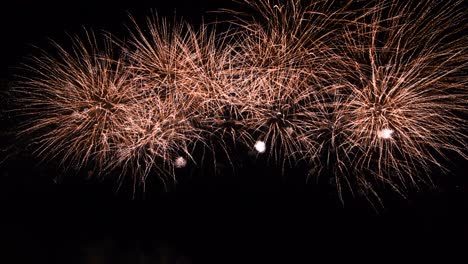 long time seamless loop of real colourful fireworks festival display at night during national holiday, new year party 2022