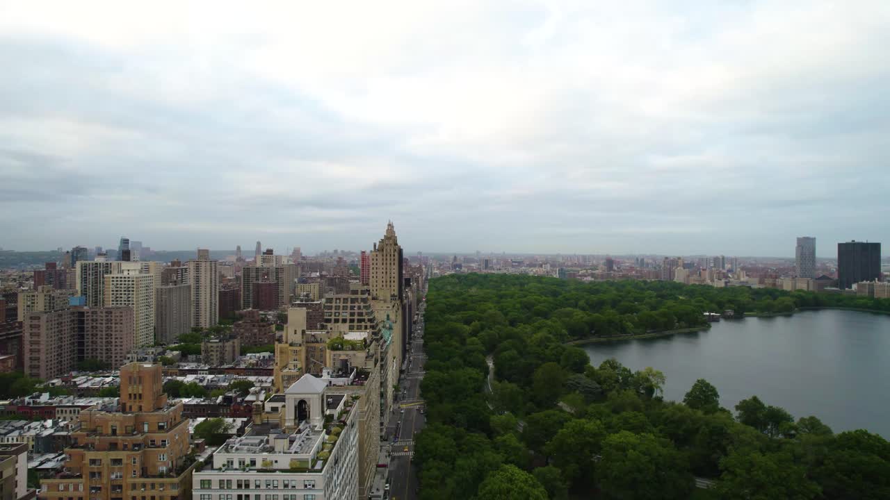 New York's Central Park West facing uptown, with reservoir, park and luxury apartments