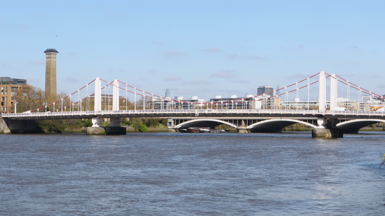 Chelsea Bridge in London, UK, spanning the River Thames on a bright, sunny day