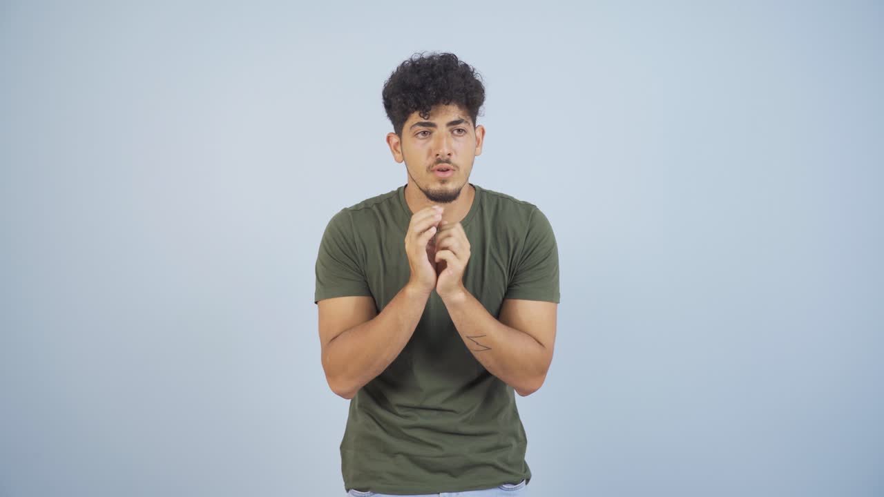 Fear reaction of man looking at camera. Coward man.
