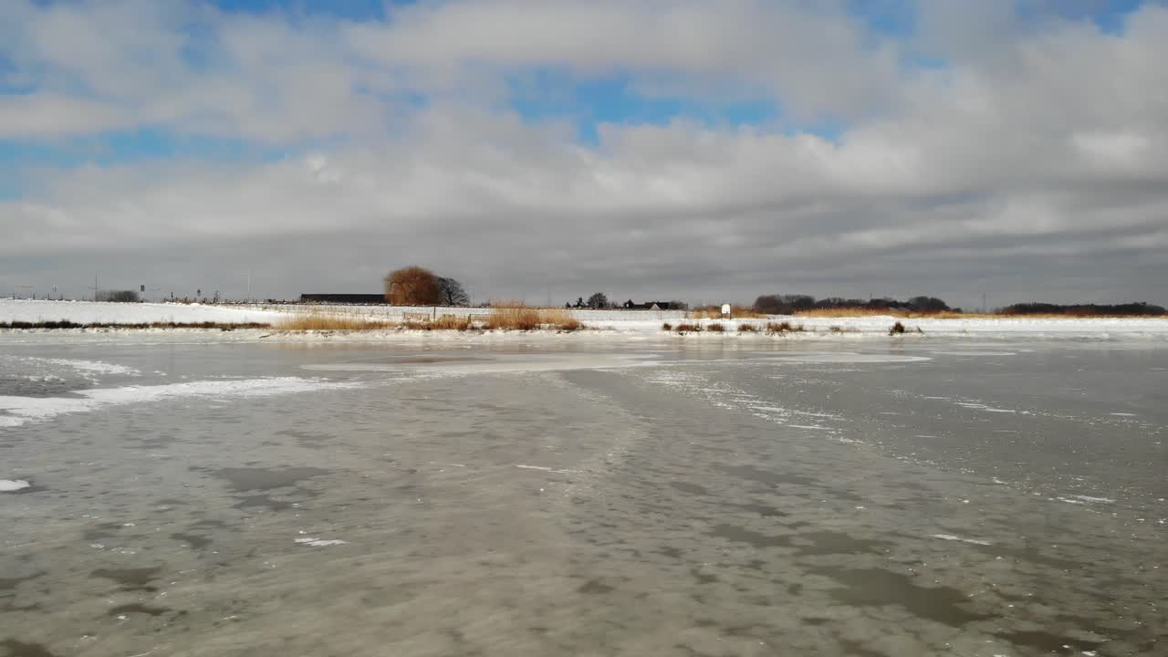 Cloudscape Over Frozen Wetland At Crezeepolder Near Ridderkerk In South Holland, Netherlands. - Low Aerial Shot