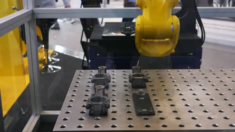 industrial robot handling metal parts