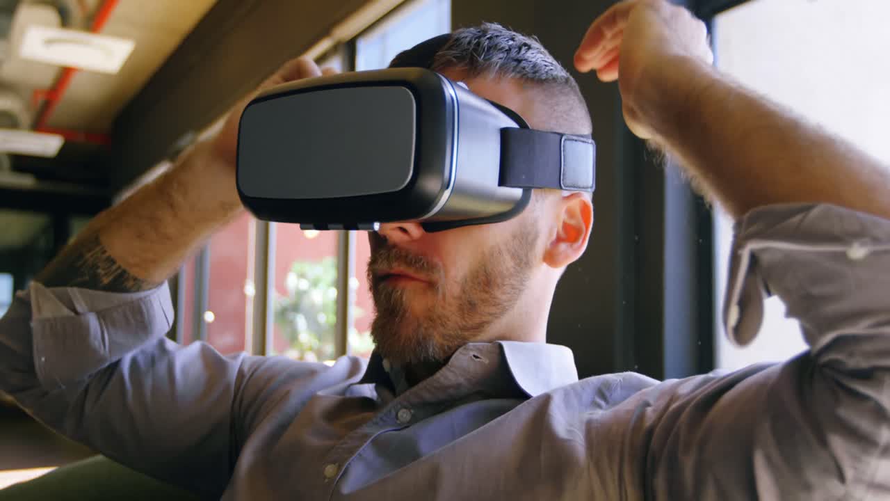 Male executive using virtual reality headset 4k