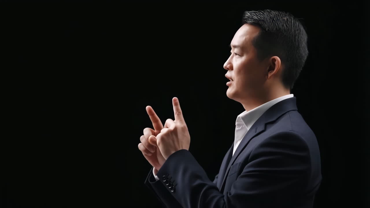 Professional Businessman Gesturing and Speaking on Black Background
