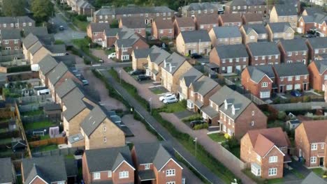 property ladder new british housing estate aerial view overlooking rooftops slow right