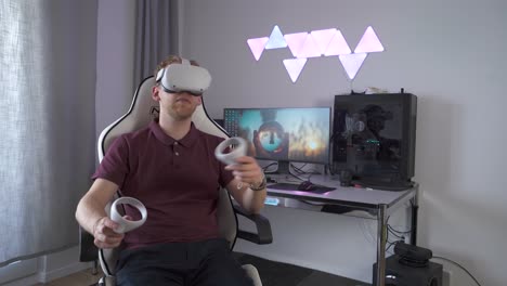 man wearing vr headset in home office